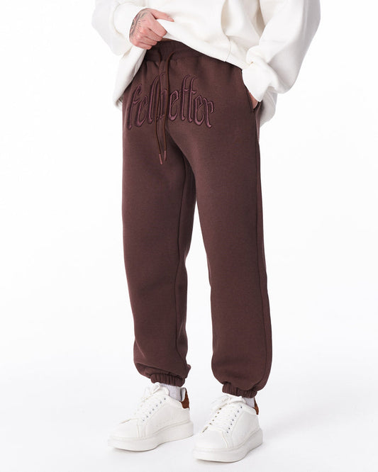 Martin Valen brown "Fell Better" men's jogger, mid-body view showing drawstring and embroidered lettering