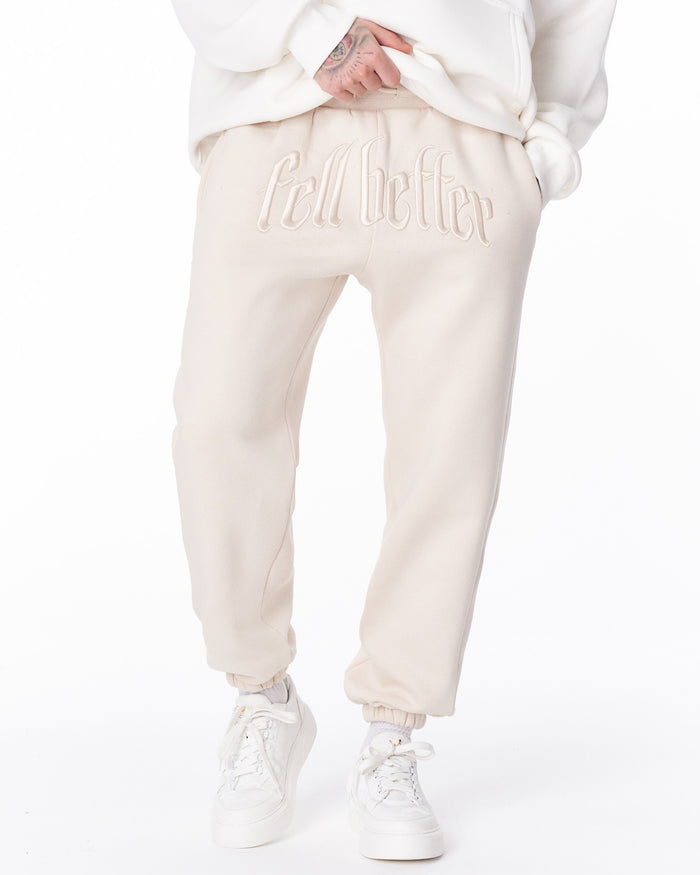 Martin Valen "Fell Better" men's beige jogger rear view, gathered cuff and white sneaker sole visible