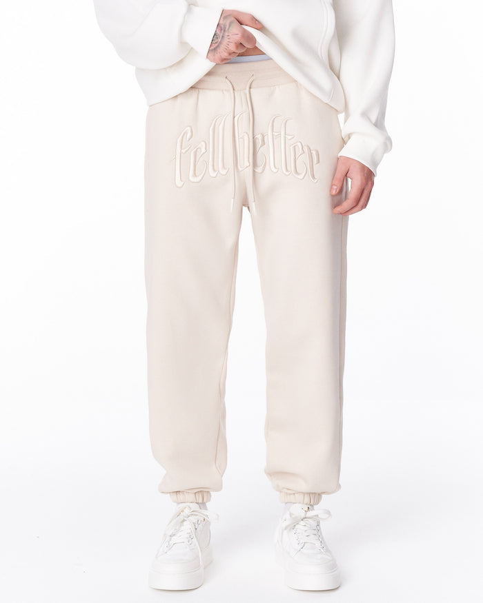 Martin Valen "Fell Better" men's beige jogger, full front view showing straight cut and elastic cuffs