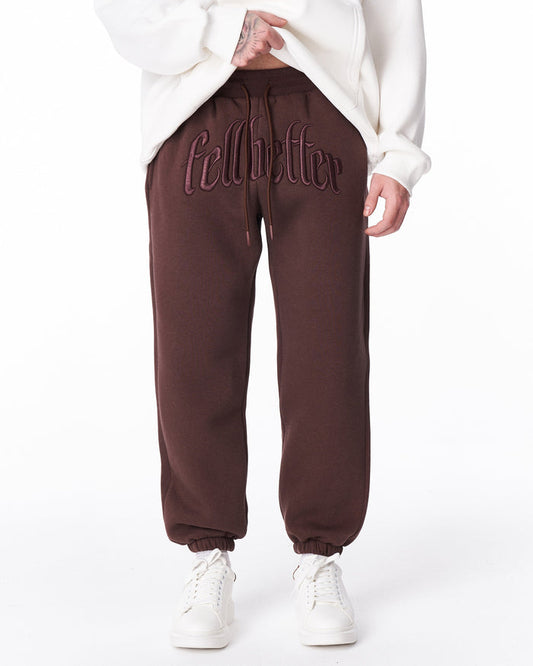 Martin Valen brown "Fell Better" men's jogger, front close-up showing embroidered logo on the waistband