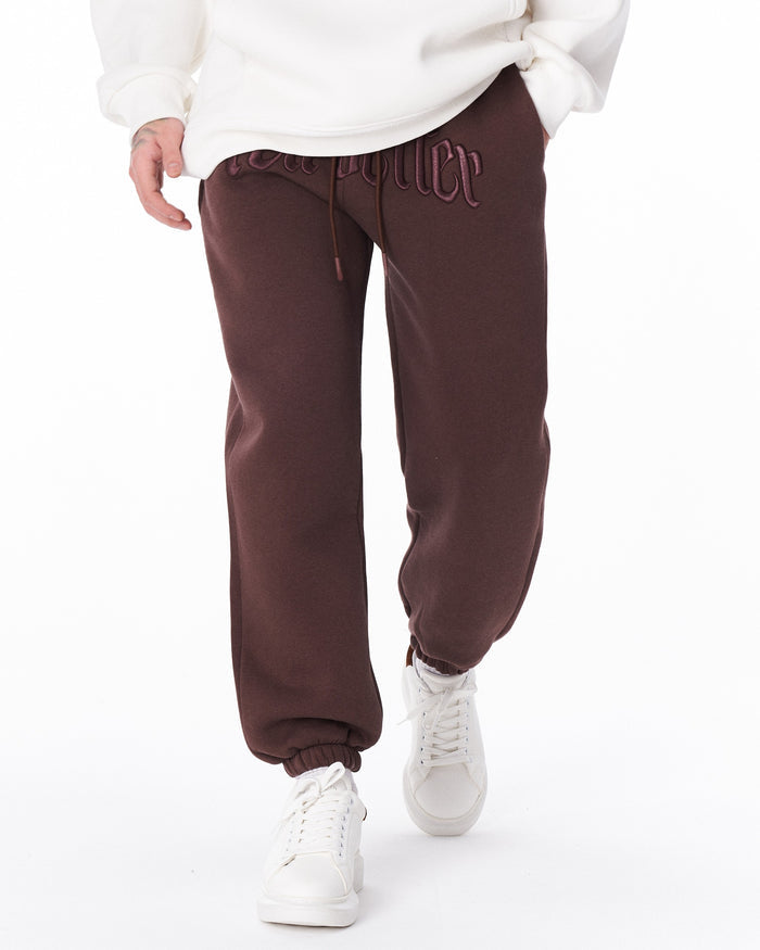 Martin Valen brown "Fell Better" jogger seen front-on with embroidered waist logo and visible drawstring