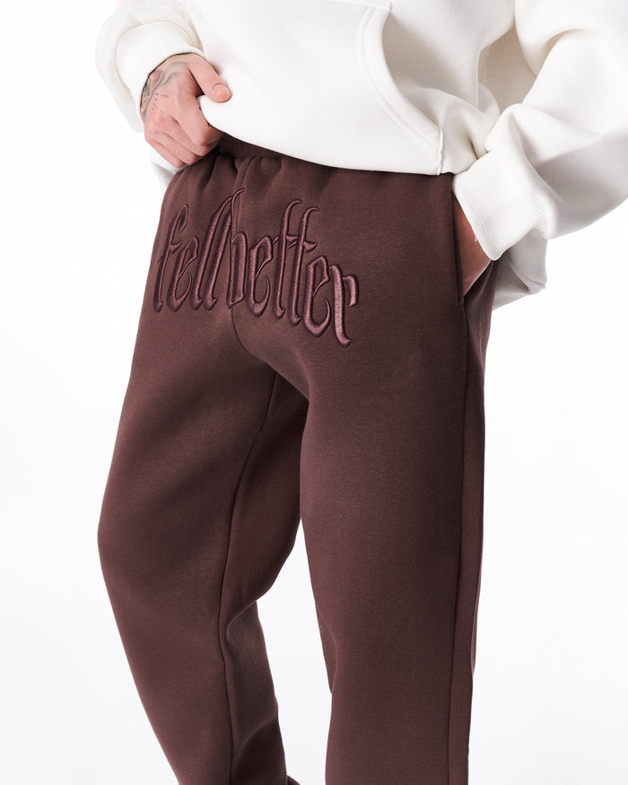 Martin Valen “Fell Better” brown jogger, full-leg view showing side seam and elasticated ankle cuff on right leg