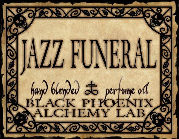 Label for 'Jazz Funeral' perfume oil by Black Phoenix Alchemy Lab with decorative border.